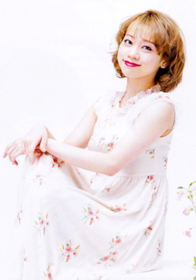 Maaya Kiho, sitting and looking at the camera (in all her glory)